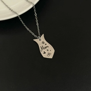 Silver stainless steel Mom heart puzzle necklace featuring butterfly and star engravings