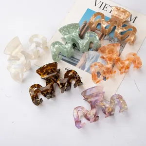 Set of 6 colorful acetate wavy hair claws in ivory, mint green, and amber finishes