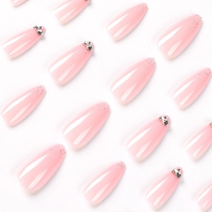 Pink gradient almond press-on nails with silver glitter tips and rhinestone accents