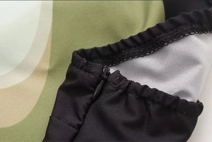 Close-up of invisible zipper and elastic hem on avocado print tube dress fabric