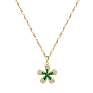 Elegant gold titanium flower necklace with green gemstones and sparkling crystals