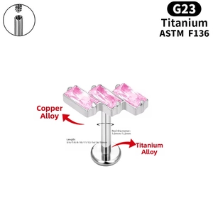 Detailed view of G23 titanium labret stud featuring three pink baguette zircons and threads