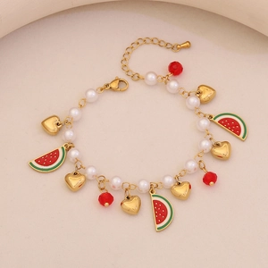 Charming gold-tone bracelet with faux pearls, watermelon enamel charms, and heart pendants