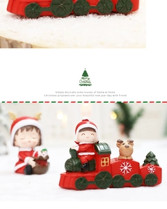 Detail of Christmas cartoon train set with Santa girl and reindeer resin figures