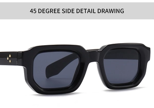Detail view of black square sunglasses with gold star hardware and grey lenses