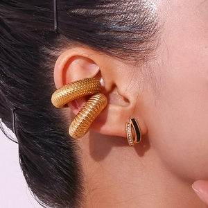 Detailed macro view of 18K gold plated textured ear cuff and black micro-inlaid earring set