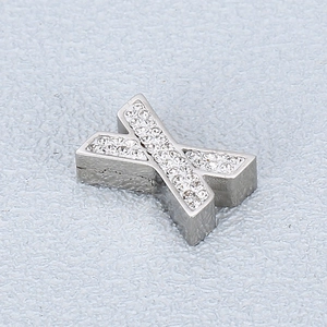 Close-up of a silver letter Y pendant inlaid with sparkling diamonds for DIY jewelry