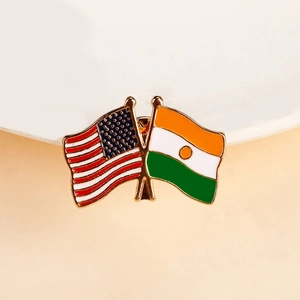 Detail of USA and Niger crossed flags lapel pin with gold plating and enamel finish
