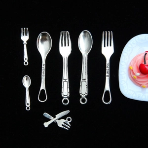 Miniature silver metal fork and spoon set for dollhouse DIY accessories on black background