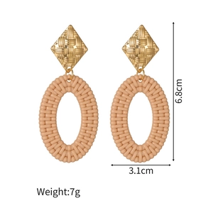 Detailed view of bohemian woven oval earrings with gold metal stud and 6.8cm size specs