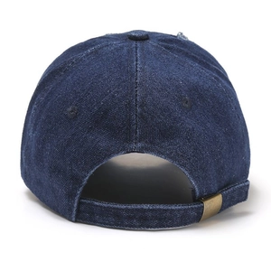 Detail of adjustable metal buckle and distressed denim texture on the back of the blue cap
