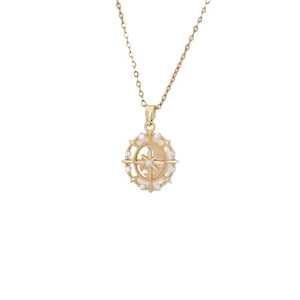 Elegant gold starburst compass necklace with white shell inlay and zircon accents