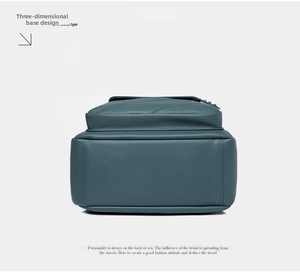 Close-up of the structured and sturdy base on this textured green leather backpack