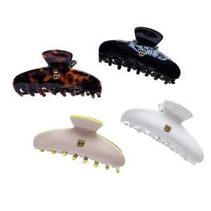 French style curved acetate shark hair clips in tortoiseshell, black, white, and beige colors