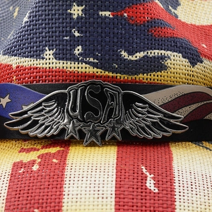 Macro view of the USA metal badge and stars on the American flag woven cowboy hat