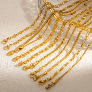 Detailed close-up of multiple 18k gold plated stainless steel chain styles with lobster clasps