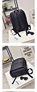 Detailed views of a black PU leather travel backpack with adjustable straps in a modern room
