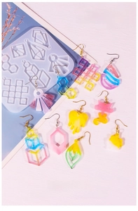Silicone mold with handmade resin earrings in heart, teardrop and geometric shapes