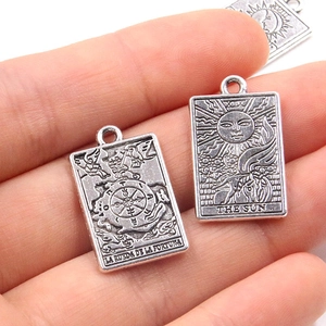Zinc alloy tarot card pendants of The Sun and Wheel of Fortune in vintage silver