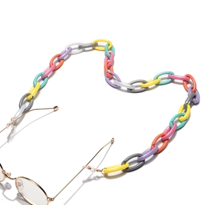 Colorful egg-shaped acrylic eyewear chain with vibrant beads on gold glasses frame
