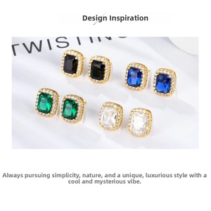 Macro shot of colorful rectangular halo stud earrings in emerald, blue, black and clear