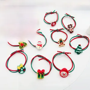 Close-up of 10-piece Christmas elastic hair ties with festive resin charms and ornaments
