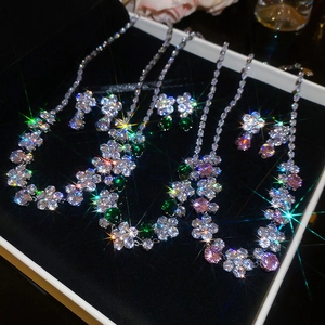 Three-piece zircon flower jewelry set including necklaces and earrings in a velvet display box