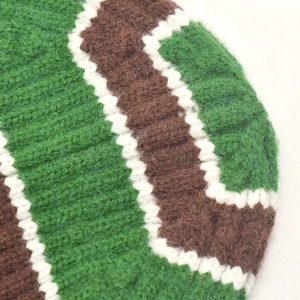 Detail of green and coffee wavy striped knit pattern with soft fluffy texture
