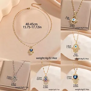 Retro copper evil eye necklace with cubic zirconia hamsa hand and blue eye pendant