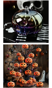 Close-up of rainbow purple and orange jack-o'-lantern ornaments for Halloween decor