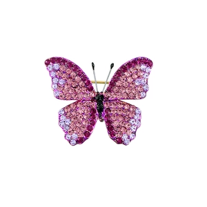 Elegant butterfly brooch with pink and purple gradient crystals on a gold setting