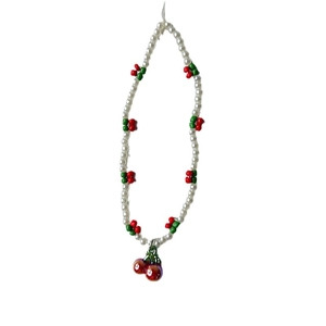 Cute cherry pearl phone charm strap featuring white beads and 3D cherry pendant on white background