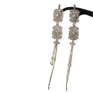 Elegant silver square tassel earrings with white diamonds and pearls on white background