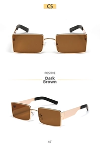 Detail view of rectangular metal sunglasses with dark brown lenses and golden frames