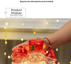 Three glowing resin snowmen Christmas figurines with LED light and red holiday hats