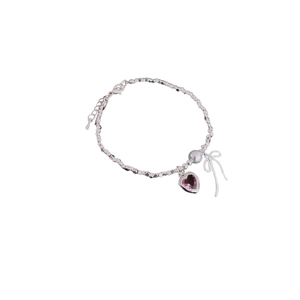 Bow pearl bracelet with pink heart zircon charm and silver beads on white background