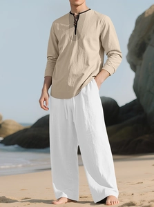 Detail of linen texture on men beach set with embroidery and drawstring waist