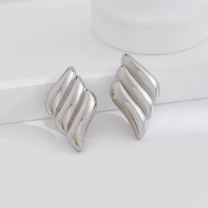 Sleek silver stainless steel wing earrings featuring a wavy textured geometric design