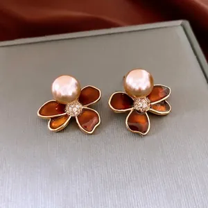 Elegant gold plated flower pearl earrings with brown enamel and zircon inlay detail