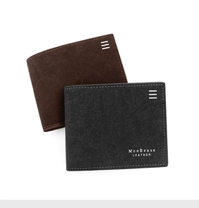 Detailed view of brown and black matte leather bifold wallets with neat stitching