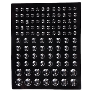 Self-adhesive clear hemispherical eye rhinestones and nail art gems on black background