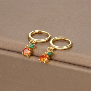 Close-up of golden fruit hoop earrings with orange and green zircon and S925 hallmark