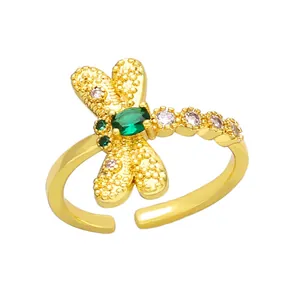 Elegant gold dragonfly open ring with a sparkling emerald zircon and crystal accents