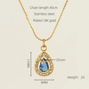 Detail of 18K gold plated stainless steel teardrop pendant with blue zircon center stone