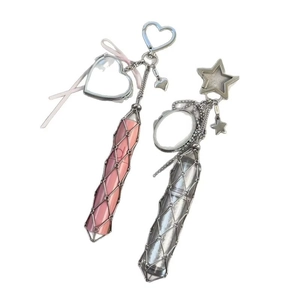 Detail of pink and silver mesh lipstick holders with heart and star carabiner clips