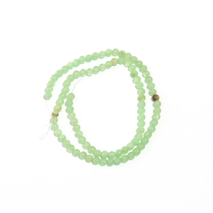 Detailed view of high-quality light green natural jade round beads for DIY jewelry making