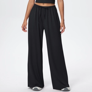 Close-up of women's black wide-leg trousers featuring a drawstring elastic waistband