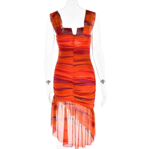 Detail view of the backless ruched dress with orange and blue stripes and ruffled hemline