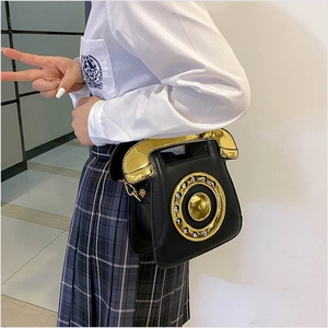 Retro telephone-shaped crossbody bag in black PU leather with gold dial and top handle