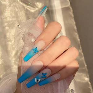 Matte long coffin press-on nails with blue butterfly patterns and gradient finish